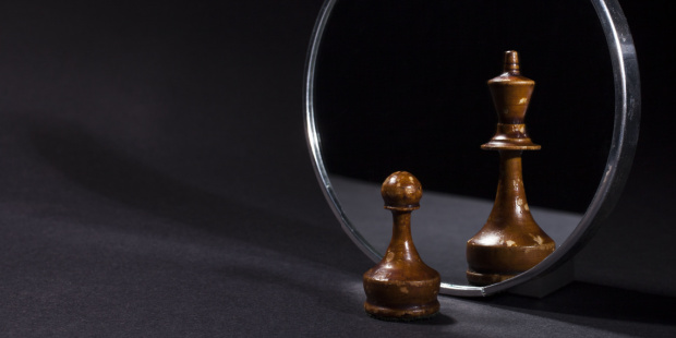 A pawn looking in the mirror and seeing a king reflected back.