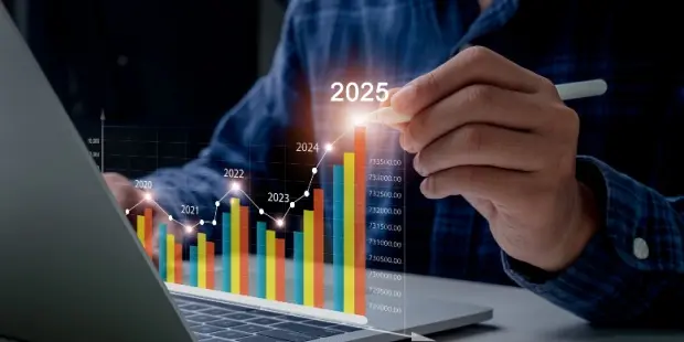 Businessman touching a digital graph showing an increase in revenue in 2025. 