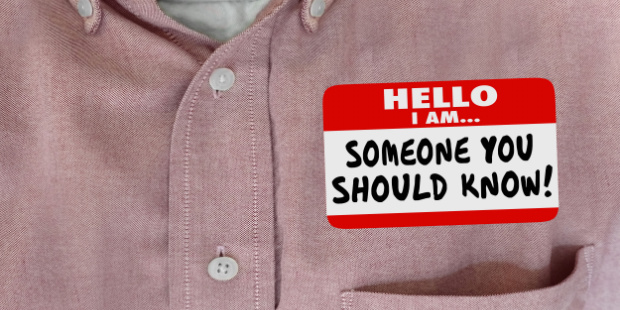 A nametag on a buttoned shirt saying: Someone you should know!