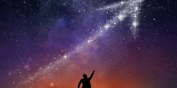 A man reaching for the stars, shaped in the form of an arrow. 