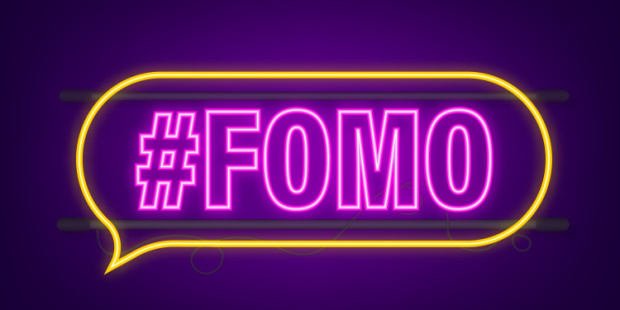 A neon sign of #FOMO.