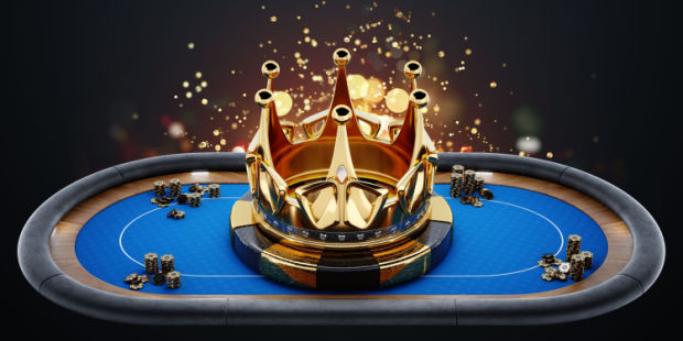 A golden crown placed on a poker table.