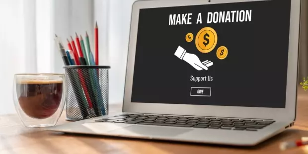 The words 'make a donation' on a computer screen. 