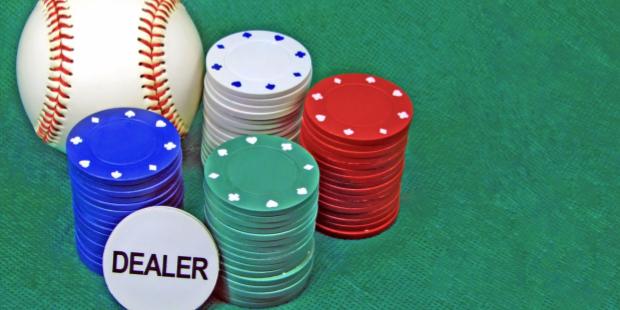 baseball appears next to poker chips on a green background