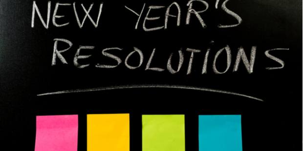 a black chalk board with New Year's Resolutions and colorful Post-its below