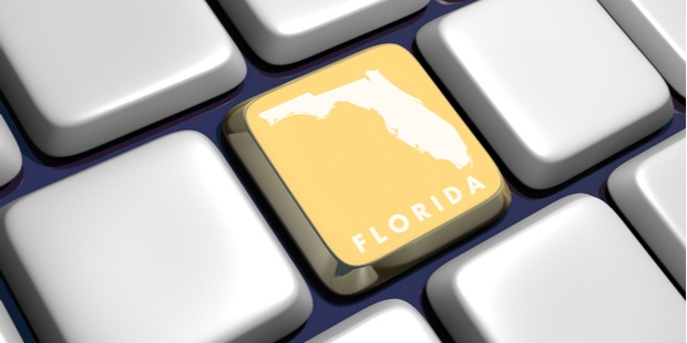 A picture of a computer keyboard, with the map of Florida on one key.