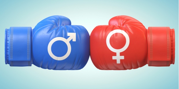 Gender symbols of both sexes on blue and red boxing gloves. 