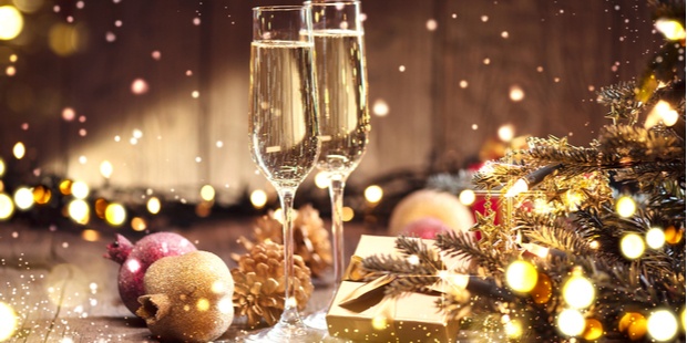 a holiday scene with two glasses of champagne