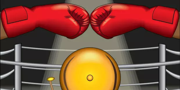 Two red gloved touching inside a boxing ring