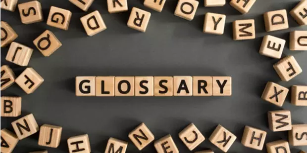 letter cubes strewn about with Glossary spelled out