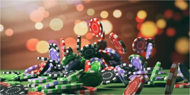 poker chips falling onto a poker table