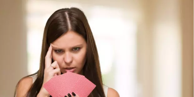 poker player thinking about her hand