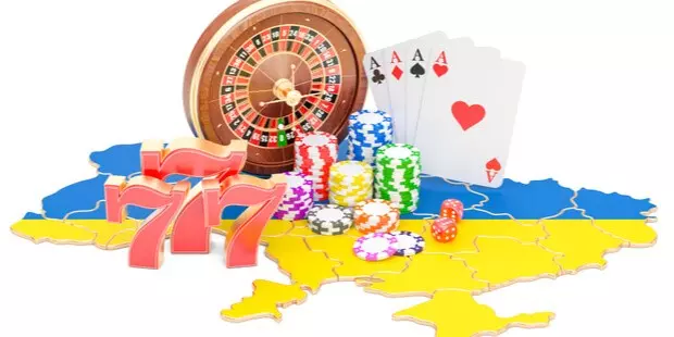 roulette table, poker chips, and cards all laid out over a map of Ukraine.