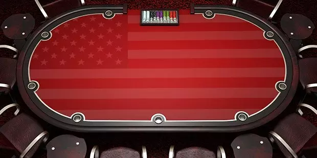 Overhead view of players at a poker table with the US flag printed on the table