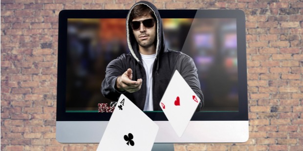 a poker player coming out of a laptop screen and throwing cards out