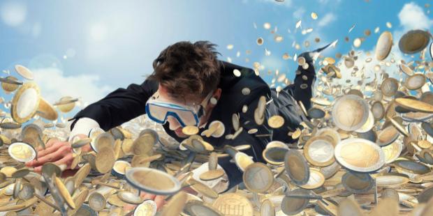 man diving into a pool of coin
