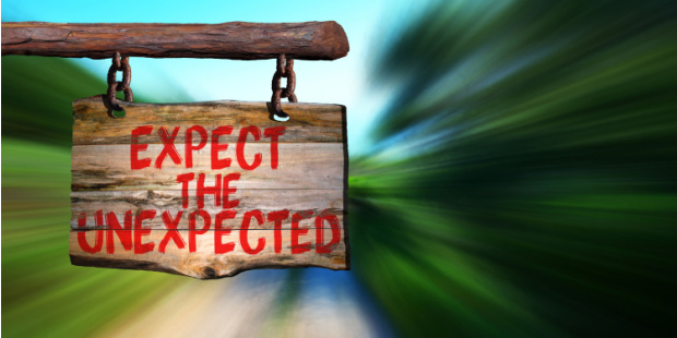 A wooden sign that reads "Expect the unexpected".