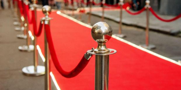 photo of a red carpet and velvet-rope barriers
