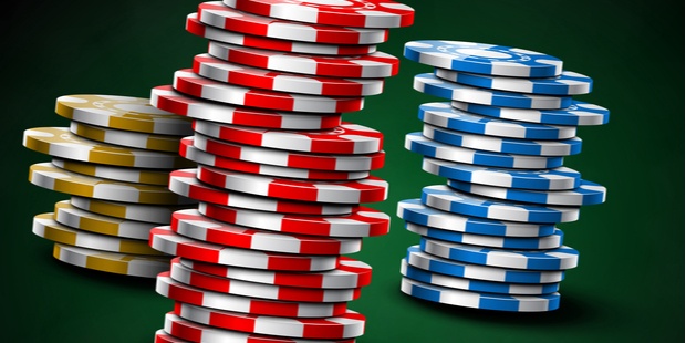 piles of poker chips on a green background