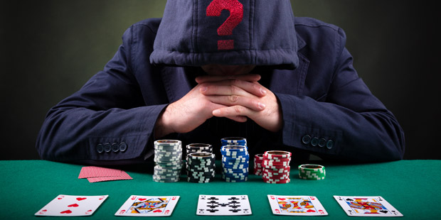 Poker player with question marks over his head