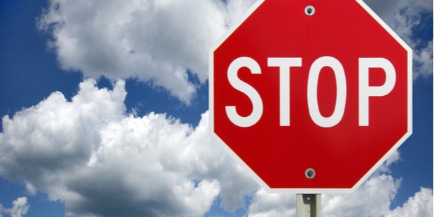 stop sign on a beautiful cloudy blue sky background