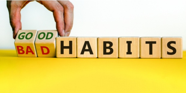 Wooden cubes spelling out the words goodbad habits.